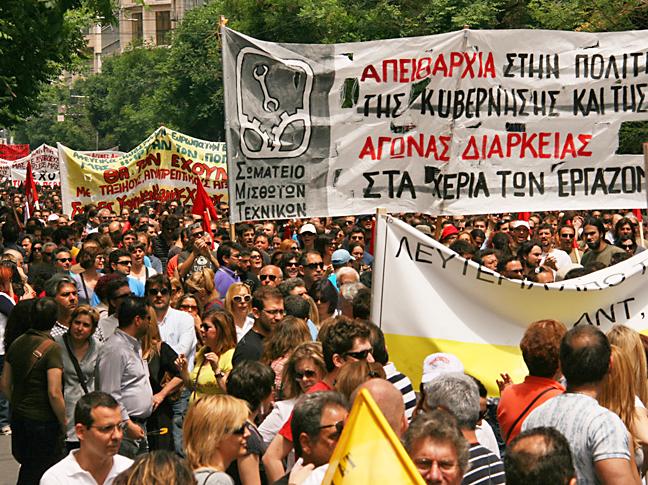 Tens of thousands of people march through the streets of Athens during a general strike