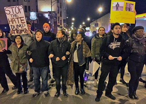 Protesters link arms outside of the Chicago Trump rally