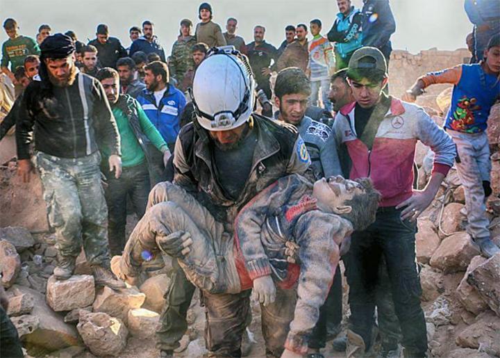 Residents of Aleppo pull victims from the rubble after another regime bombing