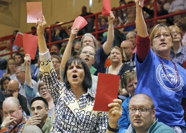 Hundreds pack a town hall meeting in Iowa to protest a Tea Party member of Congress
