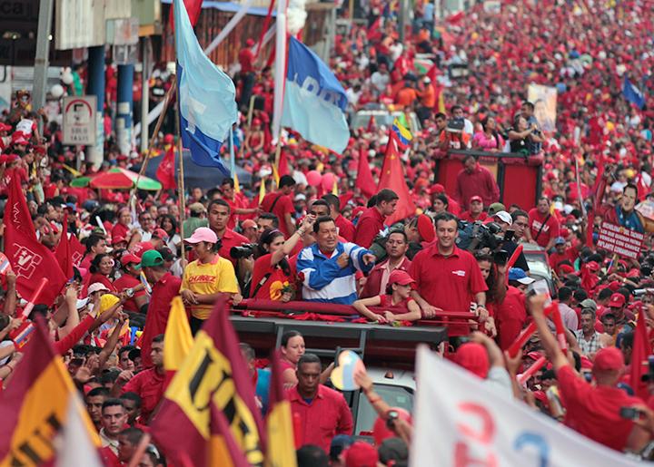 Hugo Chávez (in blue and white) joins in a mass rally in Caracas