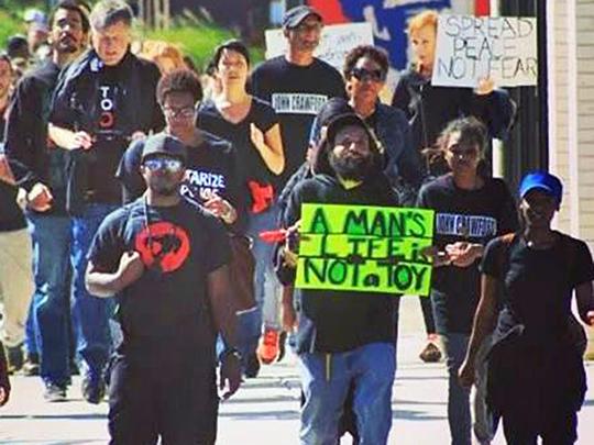 Protesters march against the police murder John Crawford III in Beavercreek, Ohio