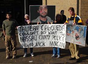 Supporters of antiwar veterans protest outside a Long Island, N.Y., courthouse