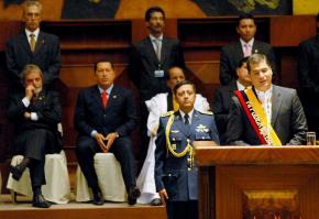 Rafael Correa gives his inaugural address as Venezuela's Hugo Chávez and Brazil's Luiz Inácio Lula da Silva look on