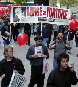 Protesters march in defense of the victims of police torture under Commander Jon Burge