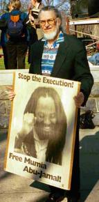 Dennis Brutus attends a protest for Mumia Abu-Jamal