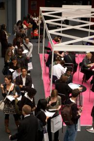 Young job seekers wait to sit down with career counselors as a job fair