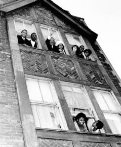 Martin Luther King Jr. and Coretta Scott King wave to supporters after moving into an apartment on Chicago's West Side in 1966.