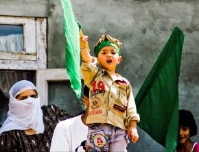 A little boy takes part in mass protests against the Indian occupation of Kashmir