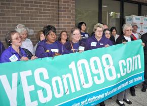 Members of SEIU show their support for I-1098