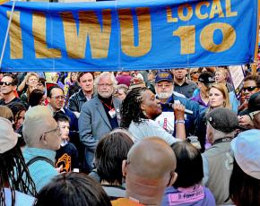 ILWU Local 10 members and supporters gather for a rally
