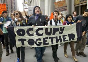 Participants in the occupation of Wall Street march toward the Brooklyn Bridge