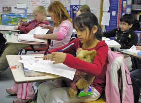 Fourth graders work on a math test