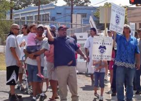 Teamsters and their supporters demonstrate for justice outside the C.H. Guenther & Sons flour mill