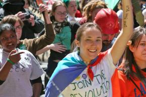 Protesters march outside a meeting of the IMF and World Bank in Washington, D.C.