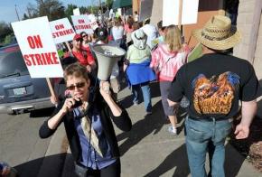 Striking teachers picket outside Eagle Point High School