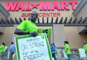 Striking Wal-Mart workers picket outside a store in Pico Rivera, Calif.