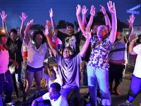 A vigil in Ferguson, Mo., for the victim of police murder