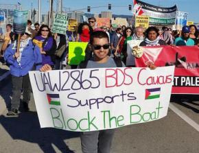 UAW Local 2865 member supporting BDS at the Block the Boat action in the Bay Area