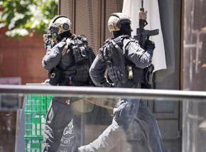 Sydney police deployed outside the Lindt Café