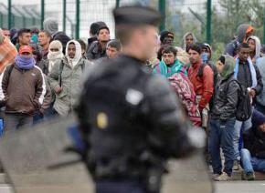 French police carry out an operation to clear a migrant camp