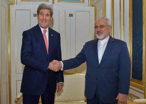 Secretary of State John Kerry stands alongside Iran's Foreign Minister Javad Zarif