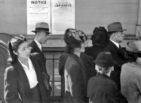 Japanese Americans lined up to register for transfer to the camps