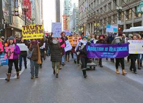 Reproductive rights activists march through Chicago's streets in the bitter cold