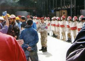 Military police surround the striking shipyard workers in Alexandria