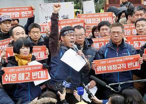 Han Sang-gyun speaks to supporters outside the Buddhist temple where he took refuge from arrest