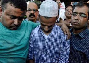 Mourners gather for the funeral of Imam Maulama Akonjee