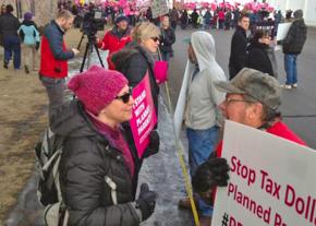 Supporters of a woman's right to choose face off against antis at a Twin Cities Planned Parenthood facility