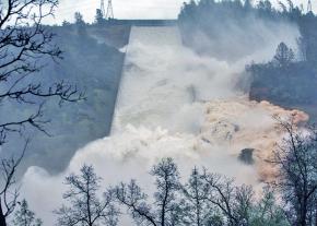 Water from the Oroville Dam in Northern California rages down a spillway
