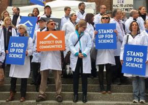 Climate scientists stand up outside the American Geophysical Union meeting in San Francisco