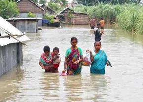 Residents of rural Bangladesh attempt to escape deadly floodwaters