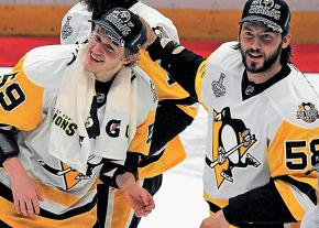 Members of the Pittsburgh Penguins celebrate after their championship victory