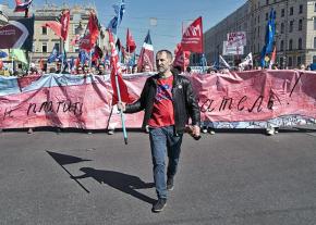 Russian labor activist Alexei Etmanov leads a demonstration of autoworkers through St. Petersburg
