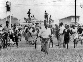 Fleeing police gunfire in Sharpeville, South Africa in 1960