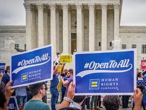 Supporters of LGBTQ rights rally outside the U.S. Supreme Court as the Masterpiece Cakeshop decision is announced