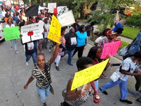Family and friends of Keeven Robinson march alongside solidarity activists in New Orleans