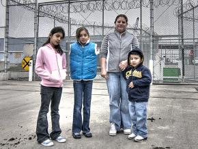 A family of immigrants stands outside the Northwest Detention Center in Tacoma, Washington