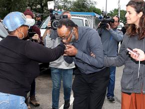 Jackie Wilson (center) greets supporters after his release from prison in Chicago