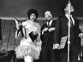 Aretha Franklin (left) and Martin Luther King Jr. on stage together in Detroit in 1968