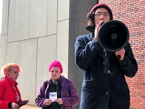 Students stand up to the far right at the State University of New York–New Paltz